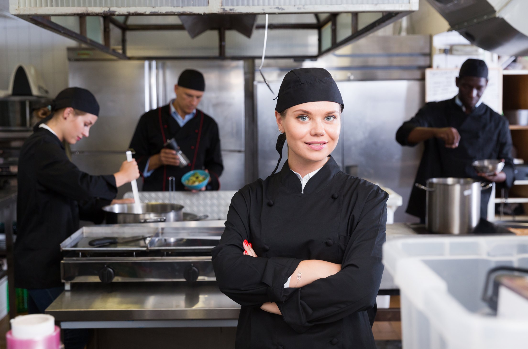 Confident young woman chef
